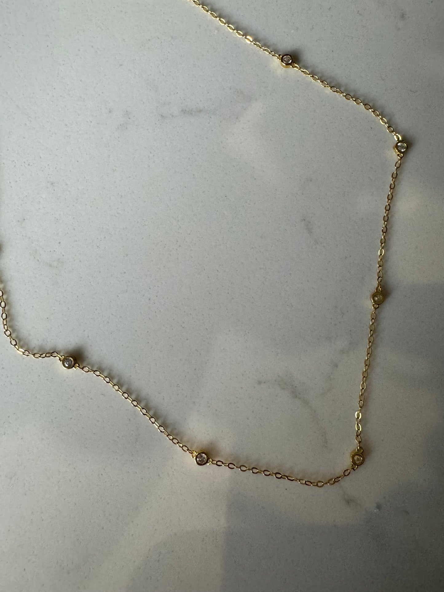 Gold diamanté charm necklace 63