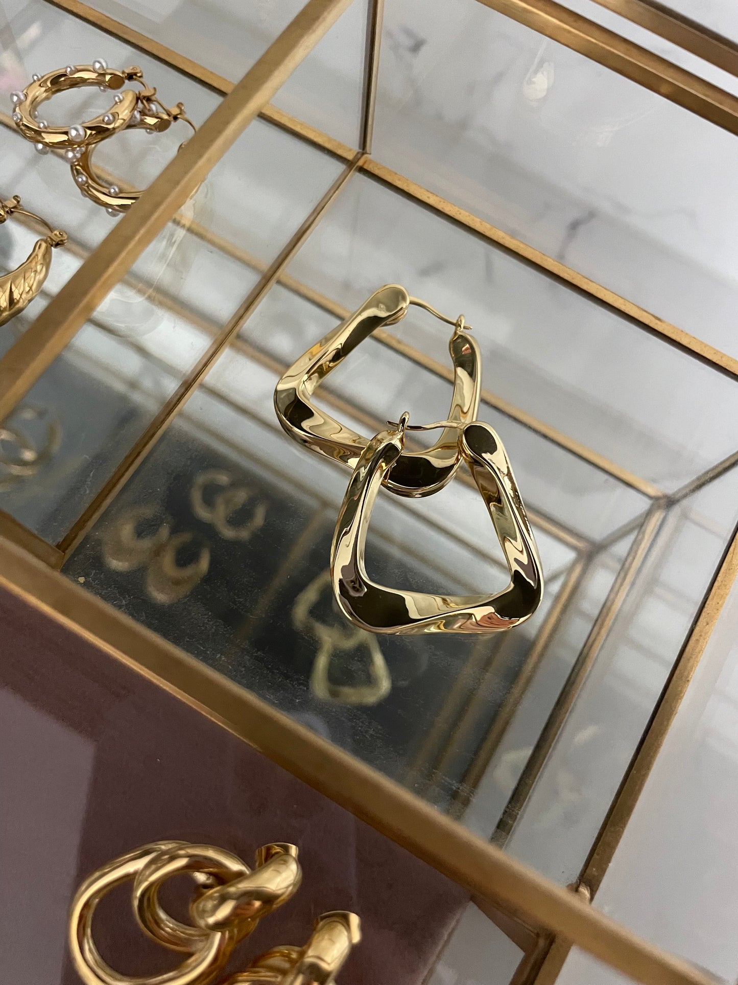 Gold twisted triangle earrings small 32